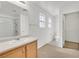 Well-lit bathroom featuring a shower, vanity, toilet, and bright windows at 7173 Las Colinas Ave, Las Vegas, NV 89179