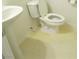 Small bathroom with a pedestal sink, toilet and a tile floor at 7173 Las Colinas Ave, Las Vegas, NV 89179