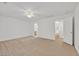 An open bedroom featuring neutral carpet and two doorways, creating an inviting space at 7173 Las Colinas Ave, Las Vegas, NV 89179