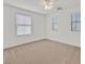 Bright, cozy bedroom with neutral carpet and abundant natural light from multiple windows at 7173 Las Colinas Ave, Las Vegas, NV 89179