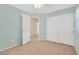 Bedroom featuring plush carpeting, connecting to a hallway, with a bright closet at 7173 Las Colinas Ave, Las Vegas, NV 89179