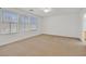 Spacious bedroom has three windows offering natural light and comfortable carpeting at 7173 Las Colinas Ave, Las Vegas, NV 89179