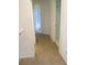 Hallway with carpeted flooring and doorways on either side at 7173 Las Colinas Ave, Las Vegas, NV 89179