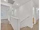 Upstairs hallway with natural light and staircase at 7173 Las Colinas Ave, Las Vegas, NV 89179