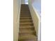 Carpeted stairs lead upstairs with white walls and a white handrail at 7173 Las Colinas Ave, Las Vegas, NV 89179
