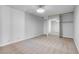 Bedroom view showing carpet, white walls, closet with mirrors and modern lighting at 725 N Royal Crest Cir # 246, Las Vegas, NV 89169