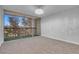 Inviting bedroom with carpet, chandelier and sliding glass doors opening to balcony at 725 N Royal Crest Cir # 246, Las Vegas, NV 89169