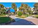 Common area with blue awning, green grass, walking paths and benches at 725 N Royal Crest Cir # 246, Las Vegas, NV 89169