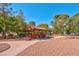 Gazebo nestled among trees with a walking path, picnic table and benches at 725 N Royal Crest Cir # 246, Las Vegas, NV 89169