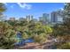 Property view featuring landscaped grounds, a tennis court and city skyline at 725 N Royal Crest Cir # 246, Las Vegas, NV 89169