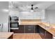 Updated kitchen features sleek stainless steel appliances and butcher block countertops at 725 N Royal Crest Cir # 246, Las Vegas, NV 89169