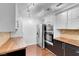 Bright kitchen boasts modern appliances and stylish butcher block countertops at 725 N Royal Crest Cir # 246, Las Vegas, NV 89169