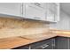 This kitchen has tile backsplash and butcher block countertop at 725 N Royal Crest Cir # 246, Las Vegas, NV 89169