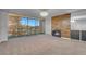 Large living room including a fireplace, chandelier and balcony at 725 N Royal Crest Cir # 246, Las Vegas, NV 89169