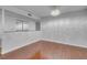 A bright living space with hardwood flooring, a modern ceiling light and ample natural light at 725 N Royal Crest Cir # 246, Las Vegas, NV 89169