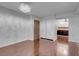 A bright living space featuring hardwood floors, closet doors, and partial kitchen view at 725 N Royal Crest Cir # 246, Las Vegas, NV 89169