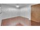 Open living space boasting hardwood floors, a modern ceiling light and ample natural light at 725 N Royal Crest Cir # 246, Las Vegas, NV 89169