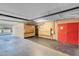 View of community parking garage with mailboxes and red fire doors at 725 N Royal Crest Cir # 246, Las Vegas, NV 89169