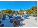 This community patio has ample seating with multiple chairs, sofas, and tables at 725 N Royal Crest Cir # 246, Las Vegas, NV 89169