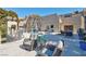 This community patio has multiple chairs and tables for seating outside at 725 N Royal Crest Cir # 246, Las Vegas, NV 89169