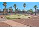 Putting green nestled among trees with a path winding around at 725 N Royal Crest Cir # 246, Las Vegas, NV 89169