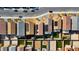 Aerial view of homes with solar panels, paved backyards with artificial grass, and neighborhood streets at 7714 Duran Harbor Ln, North Las Vegas, NV 89084