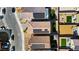 Aerial view of homes with solar panels, paved backyards with artificial grass, and neighborhood streets at 7714 Duran Harbor Ln, North Las Vegas, NV 89084