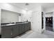 Bathroom with dual sinks, granite countertops, and spacious vanity at 7714 Duran Harbor Ln, North Las Vegas, NV 89084
