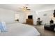 Bedroom featuring a ceiling fan, a desk, and a comfortable chair at 7714 Duran Harbor Ln, North Las Vegas, NV 89084
