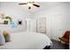 Bright bedroom with a window, ceiling fan and cozy decor at 7714 Duran Harbor Ln, North Las Vegas, NV 89084