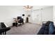 Bedroom with desk, keyboard, and striped couch at 7714 Duran Harbor Ln, North Las Vegas, NV 89084