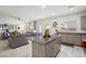 Open kitchen concept with island, seamlessly connected to the living area at 7714 Duran Harbor Ln, North Las Vegas, NV 89084