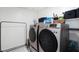 Laundry room featuring side by side washer and dryer with storage space on shelves at 7714 Duran Harbor Ln, North Las Vegas, NV 89084