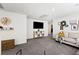 Large living room featuring a TV, console, and decor at 7714 Duran Harbor Ln, North Las Vegas, NV 89084