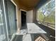 Balcony view with table, outdoor seating, and sliding glass door access at 833 Aspen Peak Loop # 1021, Henderson, NV 89011