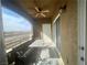 Relaxing balcony with a table, bench, ceiling fan, and an open view at 833 Aspen Peak Loop # 1021, Henderson, NV 89011