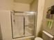 A bathroom features a glass-enclosed shower, with modern fixtures, and an ample space at 833 Aspen Peak Loop # 1021, Henderson, NV 89011
