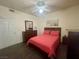 Comfortable bedroom featuring a ceiling fan, dark wood furnishings and a well-lit, clean design at 833 Aspen Peak Loop # 1021, Henderson, NV 89011