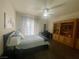 A primary bedroom features a work desk and built in storage shelves at 833 Aspen Peak Loop # 1021, Henderson, NV 89011