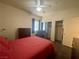 Spacious bedroom with a ceiling fan, windows, closet and a leather chair at 833 Aspen Peak Loop # 1021, Henderson, NV 89011