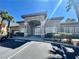 Aesthetic clubhouse entrance featuring stone accents, trimmed bushes, and a paved parking area at 833 Aspen Peak Loop # 1021, Henderson, NV 89011