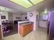 Open kitchen design featuring tile flooring and seamless flow to the dining area at 833 Aspen Peak Loop # 1021, Henderson, NV 89011