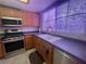 Bright kitchen featuring stainless steel appliances and a large sink with natural light at 833 Aspen Peak Loop # 1021, Henderson, NV 89011