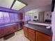 Bright kitchen features a large island, stainless steel appliances, and natural light at 833 Aspen Peak Loop # 1021, Henderson, NV 89011
