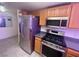 Modern kitchen with stainless steel appliances and dark countertops at 833 Aspen Peak Loop # 1021, Henderson, NV 89011