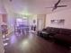 Spacious living room with a dining area and a comfortable leather couch at 833 Aspen Peak Loop # 1021, Henderson, NV 89011