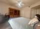Comfortable main bedroom featuring hardwood floors and built-in cabinets at 833 Aspen Peak Loop # 1021, Henderson, NV 89011
