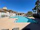 Refreshing pool featuring a lounging area and sun-soaked deck with palm trees at 833 Aspen Peak Loop # 1021, Henderson, NV 89011