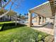 Community poolside featuring manicured lawn and shaded seating for residents at 833 Aspen Peak Loop # 1021, Henderson, NV 89011
