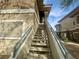 Exterior staircase leading to an upper-level unit with desert landscaping at 833 Aspen Peak Loop # 1021, Henderson, NV 89011